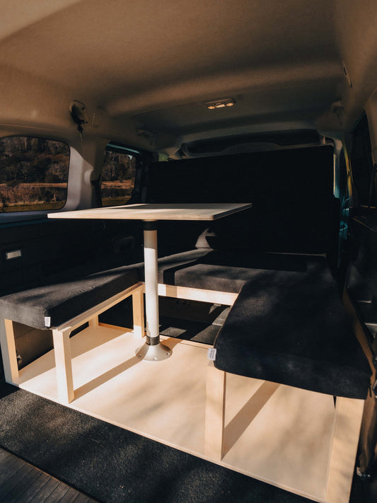 Van seating area with pop-up table installed