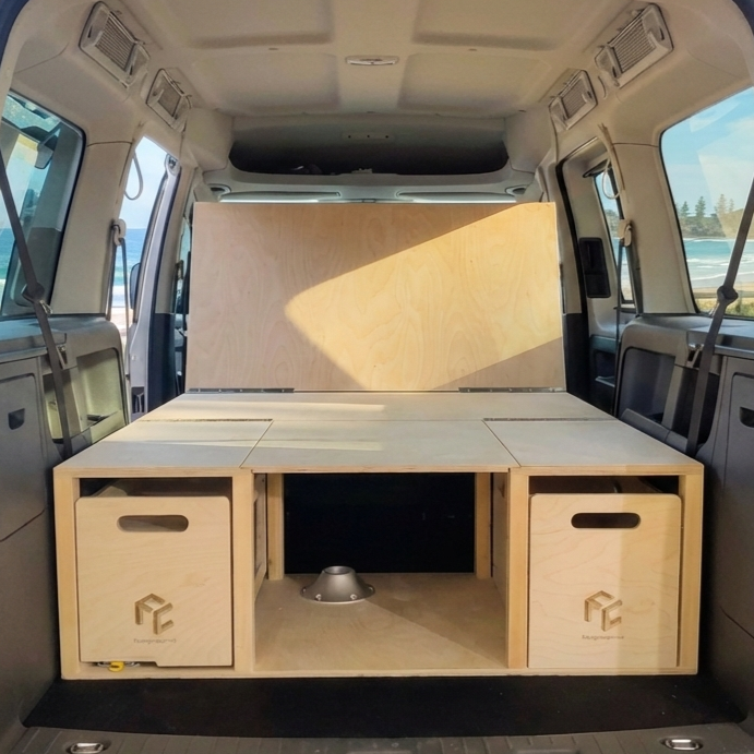 Camper kit installed in van in sofa mode